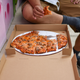 Derrick Tung, owner of Paulie Gee’s Logan Square, tastes one of Pizzadad’s creations